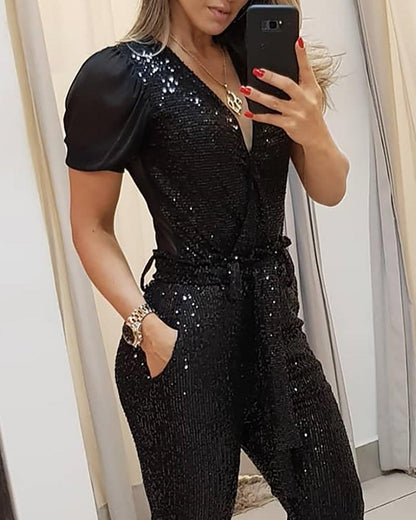 Joanne – Tief ausgeschnittener Pailletten-Jumpsuit