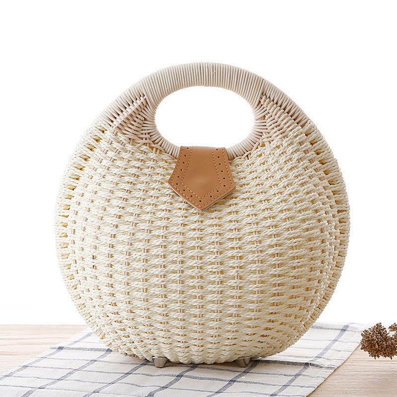 Sara – Runde Damenhandtasche aus Rattan